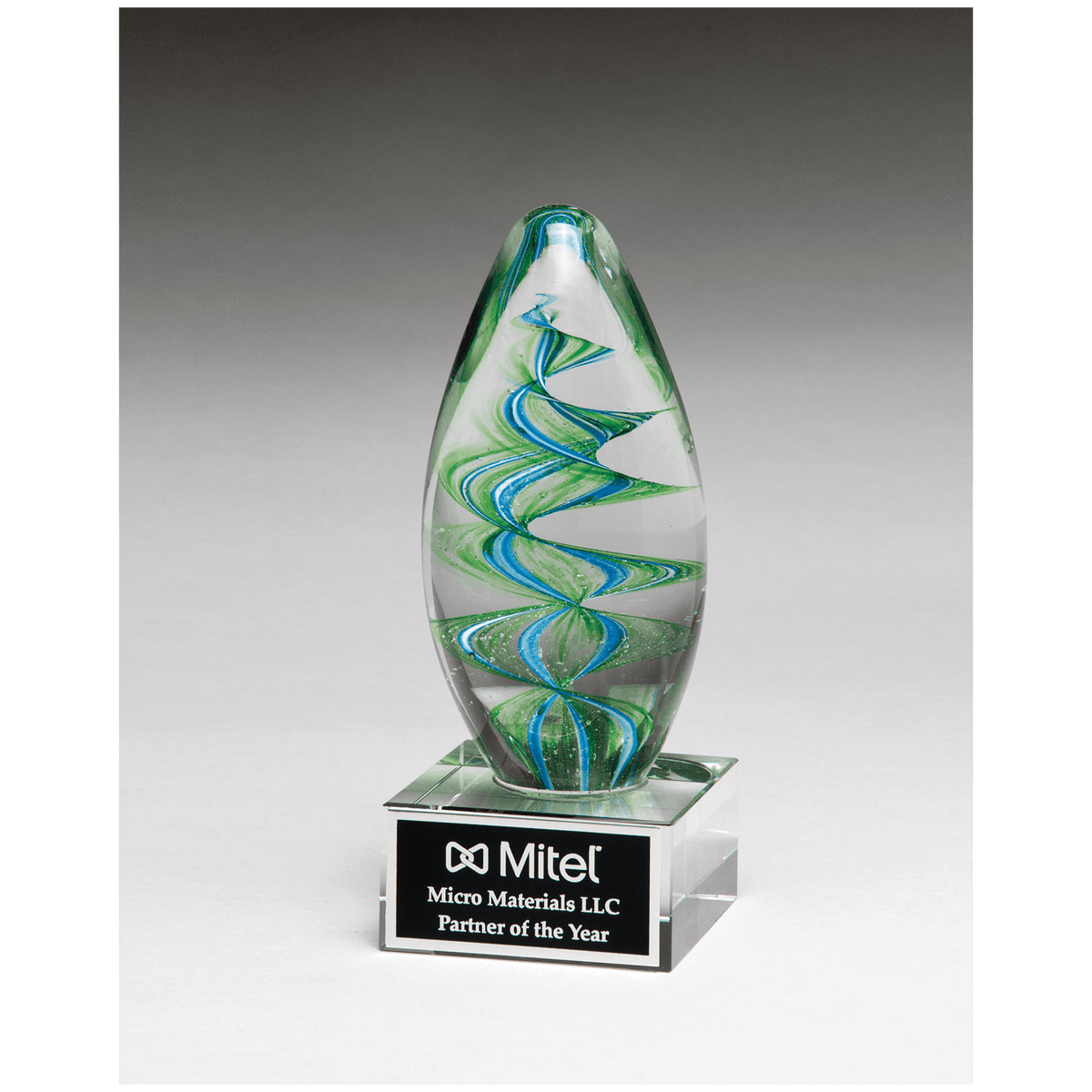 6 1/2" Blue and Green Helix Egg Shaped Art Glass on Clear Glass Base with Black Laserable Aluminum Plate