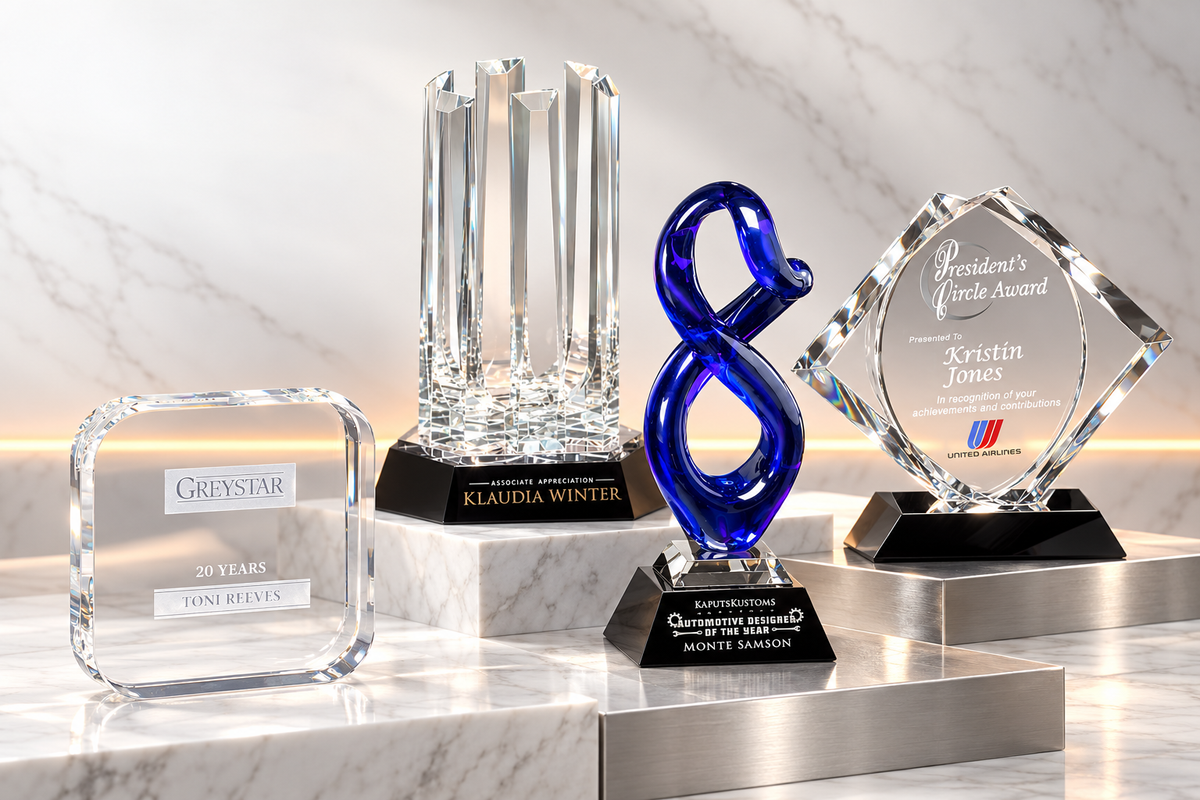 App, Artistry, Allegiance and CEO awards staged on white marble and brushed stainless platforms
